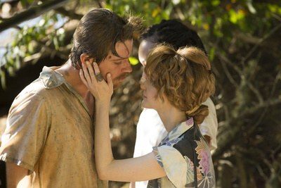 Costume design by Anette Cseri for the film Burden: a couple embracing outdoors in worn summer clothes