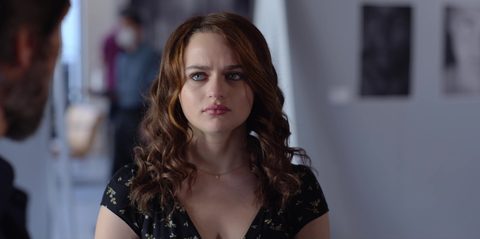Costume design by Anette Cseri for the film The In Between: a young woman in a floral top standing in an art-lined hallway