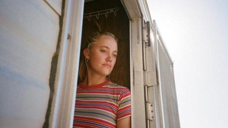Costume design by Anette Cseri for the film The Tribes of Palos Verdes: a young woman leaning against a wall in a striped tee