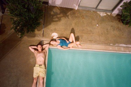Costume design by Anette Cseri for the film The Tribes of Palos Verdes: three figures lying at the edge of an empty swimming pool
